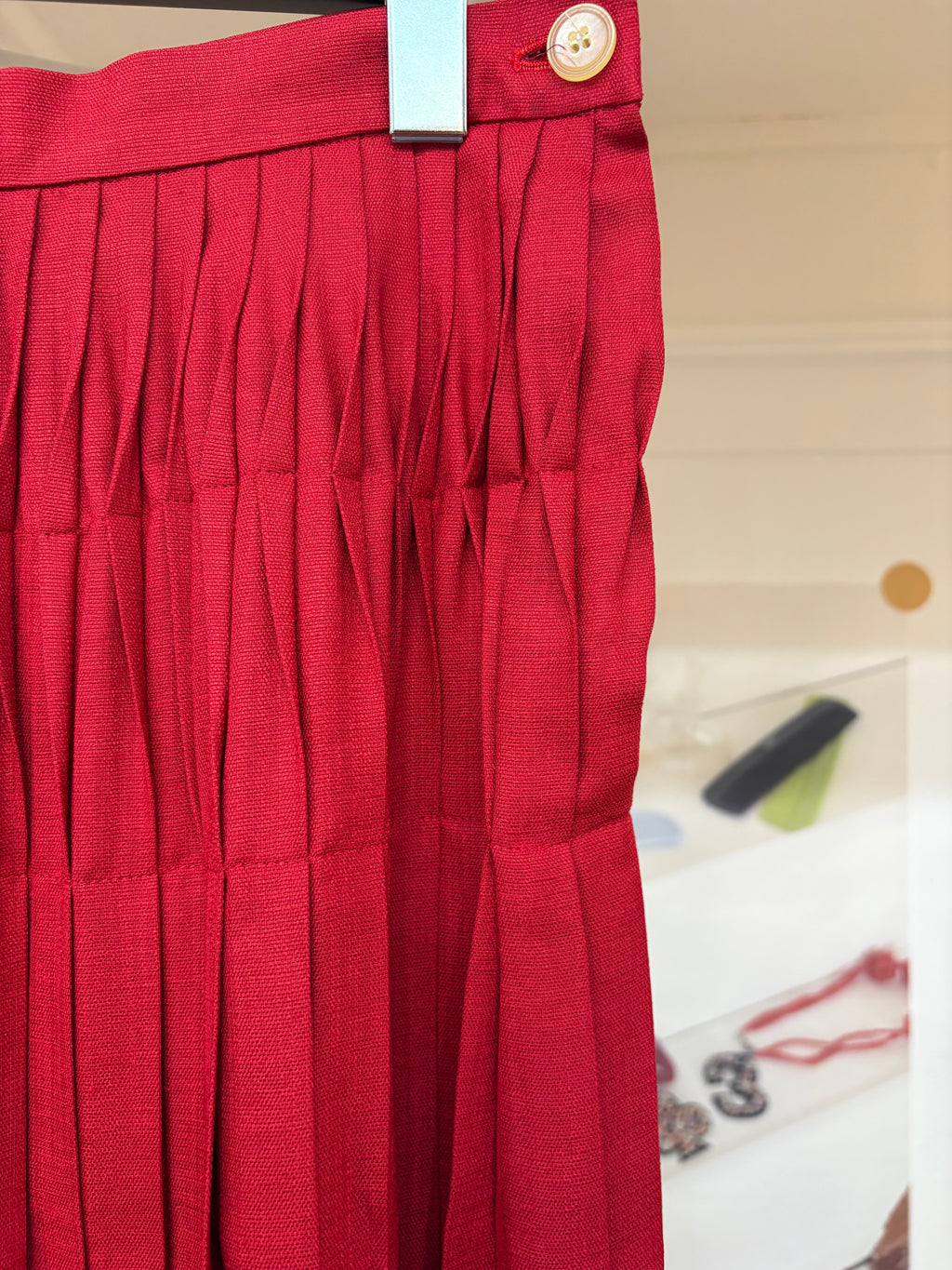 red pleats midi skirt